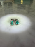 The Paraiba Halo — pear-cut Paraiba-blue stone with white halo, close detail on marble