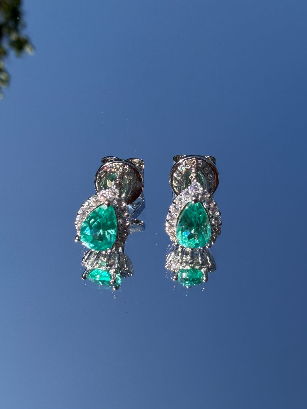 The Paraiba Halo earring pair in 925 sterling silver, rhodium-finished