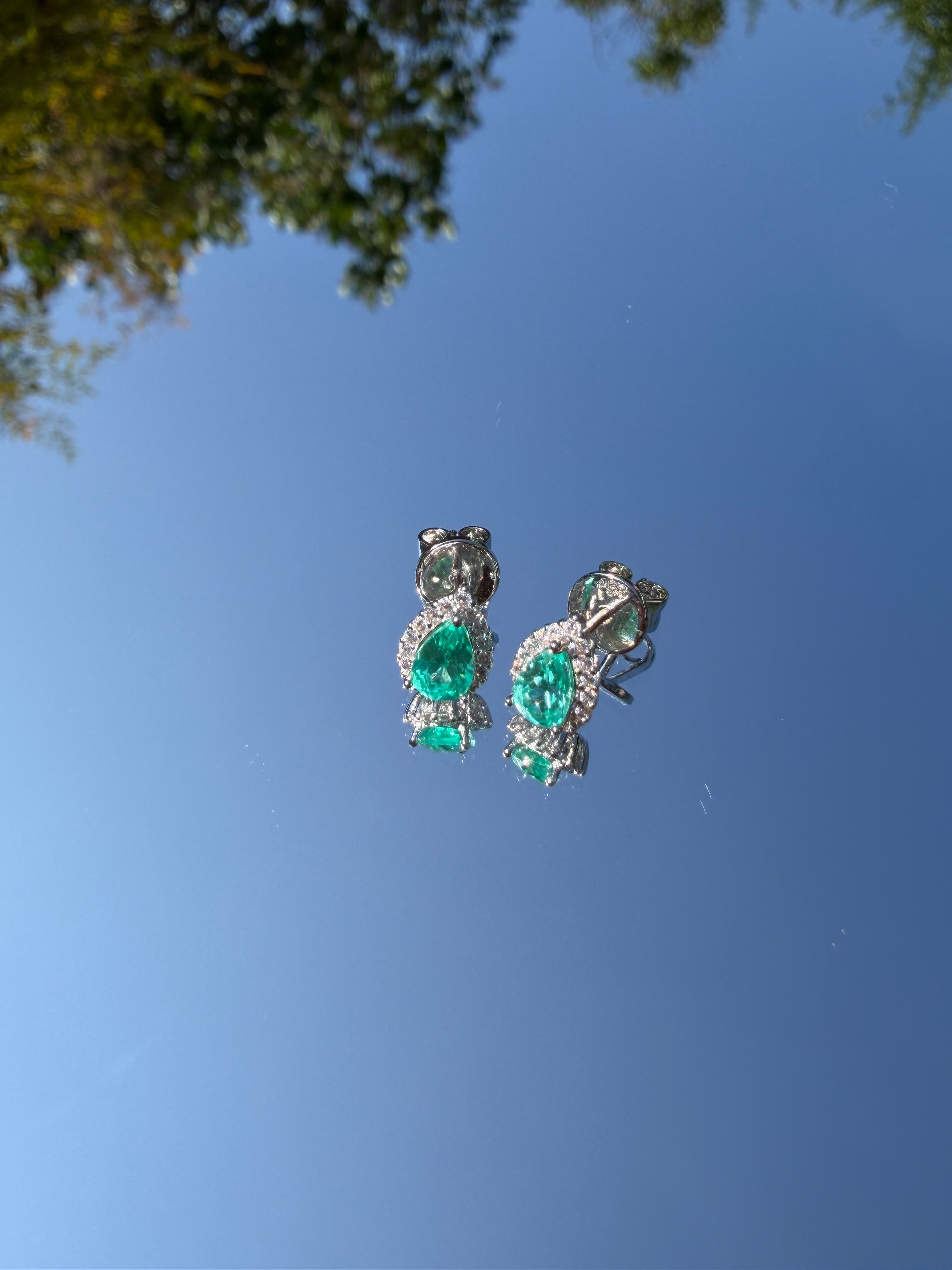 The Paraiba Halo earring pair, angled view showing the pear-cut stone and halo setting