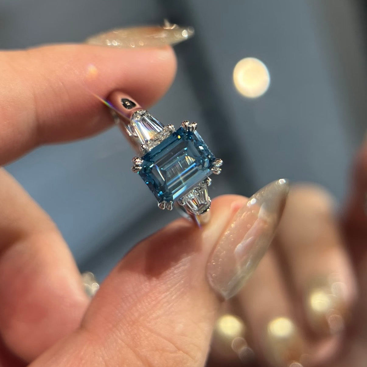 Blue fancy vivid diamond trilogy ring
