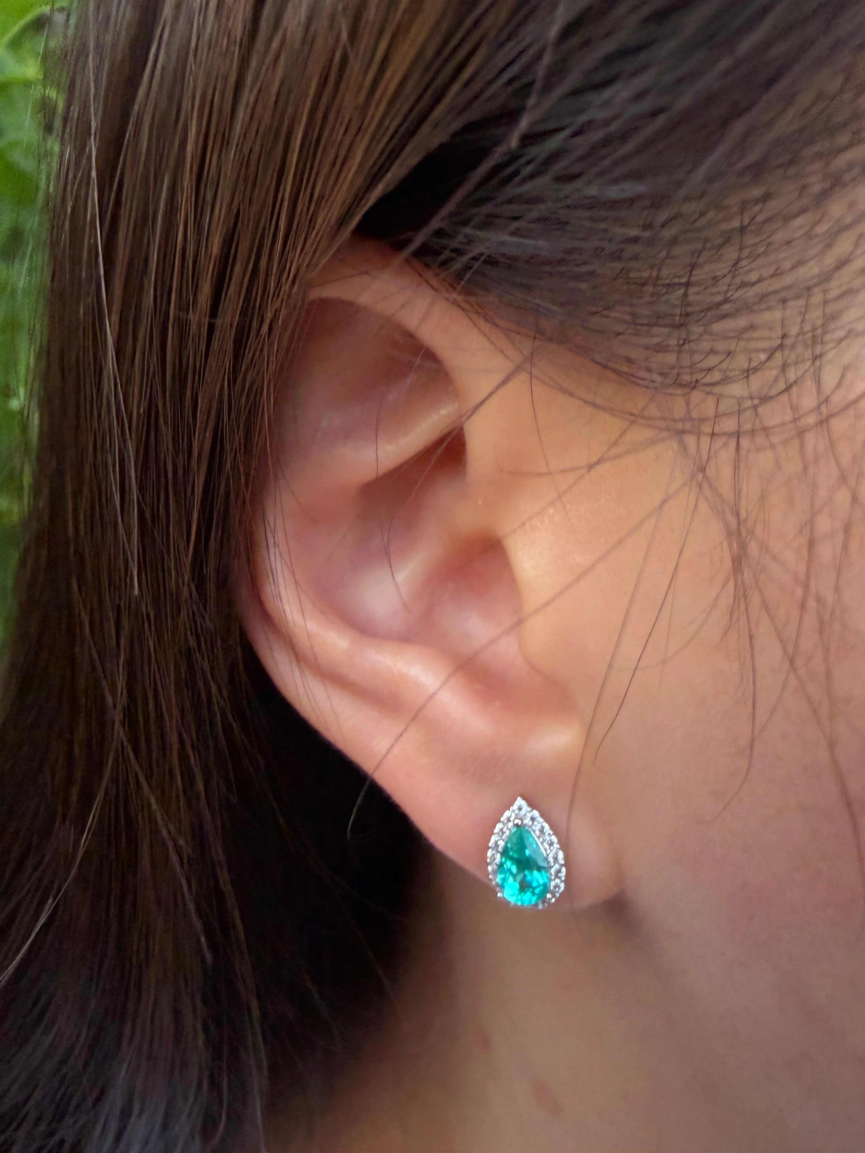 The Paraiba Halo earring worn, macro detail on the ear