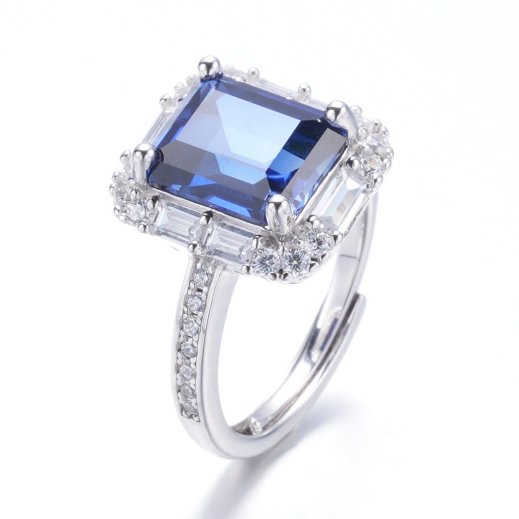 The Modern Halo — emerald-cut blue sapphire ring with halo setting in 925 sterling silver