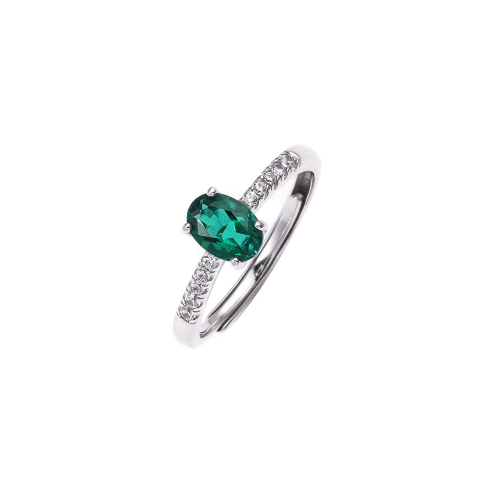 The Emerald Solitaire emerald-green gemstone ring in sterling silver by Iris & Carly