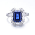 The Modern Halo — emerald-cut blue sapphire ring with halo setting in 925 sterling silver