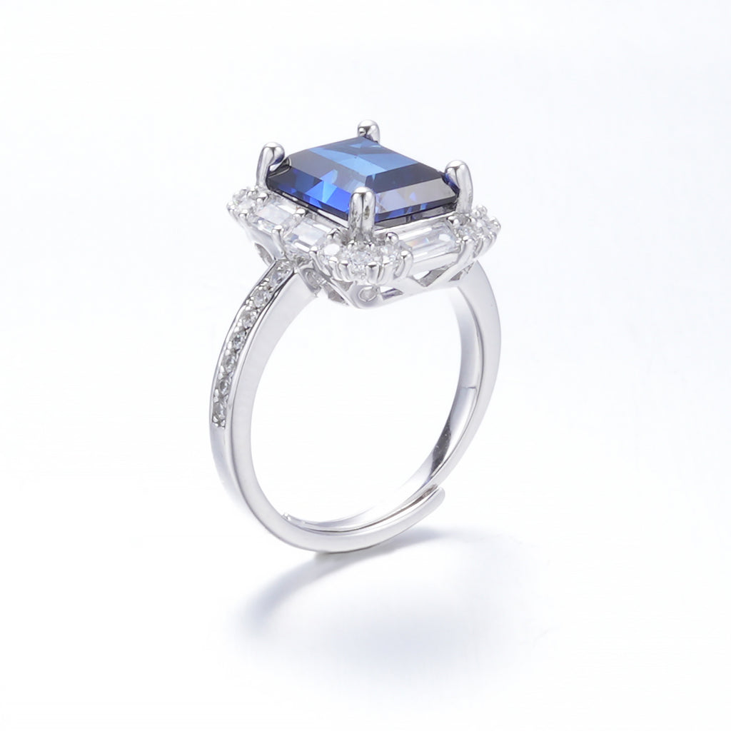 The Modern Halo — emerald-cut blue sapphire ring with halo setting in 925 sterling silver