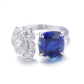 The Twilight Toi Et Moi — cushion-cut blue sapphire ring with pavé rose motif in 925 sterling silver