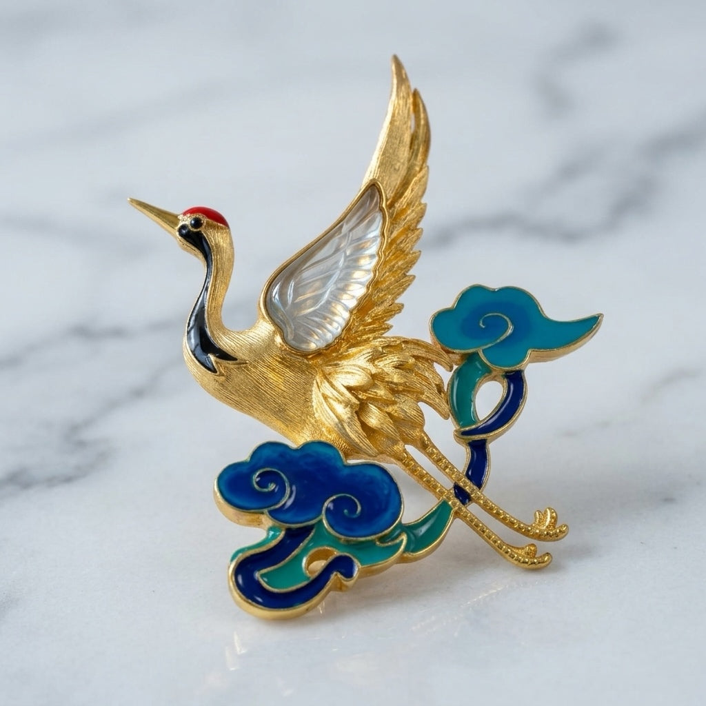 Decorative brooch with a gold crane design and jade