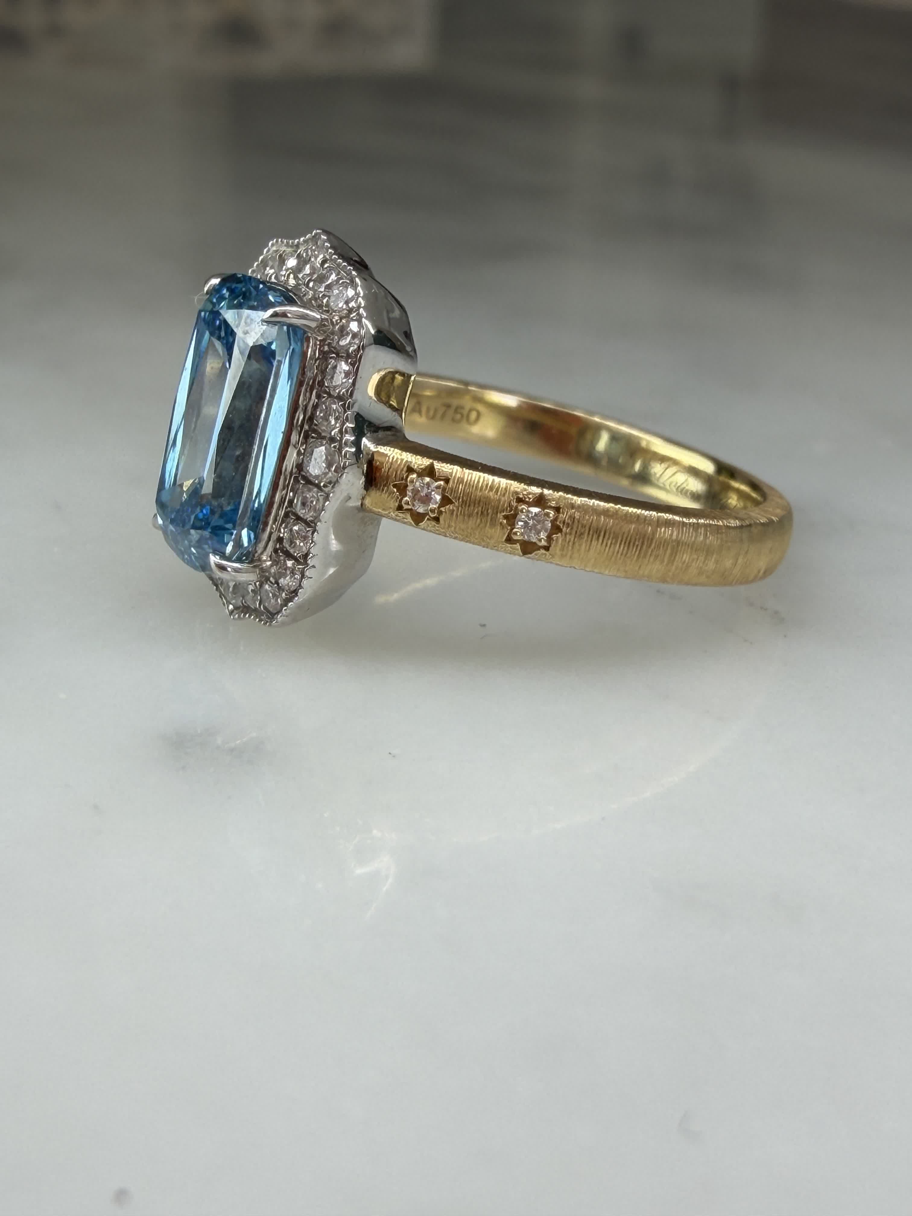 Profile of The Tidal Vow showing the scalloped diamond halo and blue diamond centre